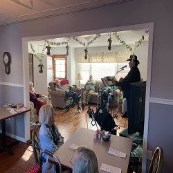 Residents and staff in a common activity area at Hillcrest